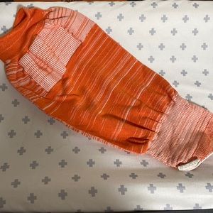 Orange Swaddelini baby swaddle